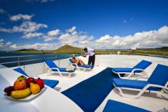 Relaxing on the sundeck of the Monserrat Galapagos Yacht