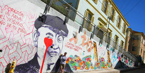 The famous British street artist Pure Evil paints a mural in Valparaiso