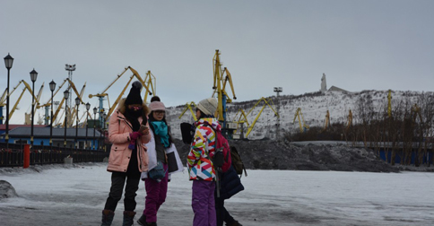 Chinese tourists on the Murmansk waterfront.