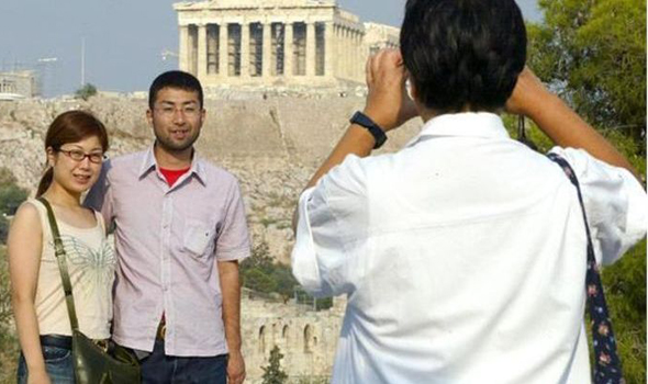 Chinese Tourists took photos at Greece attractions